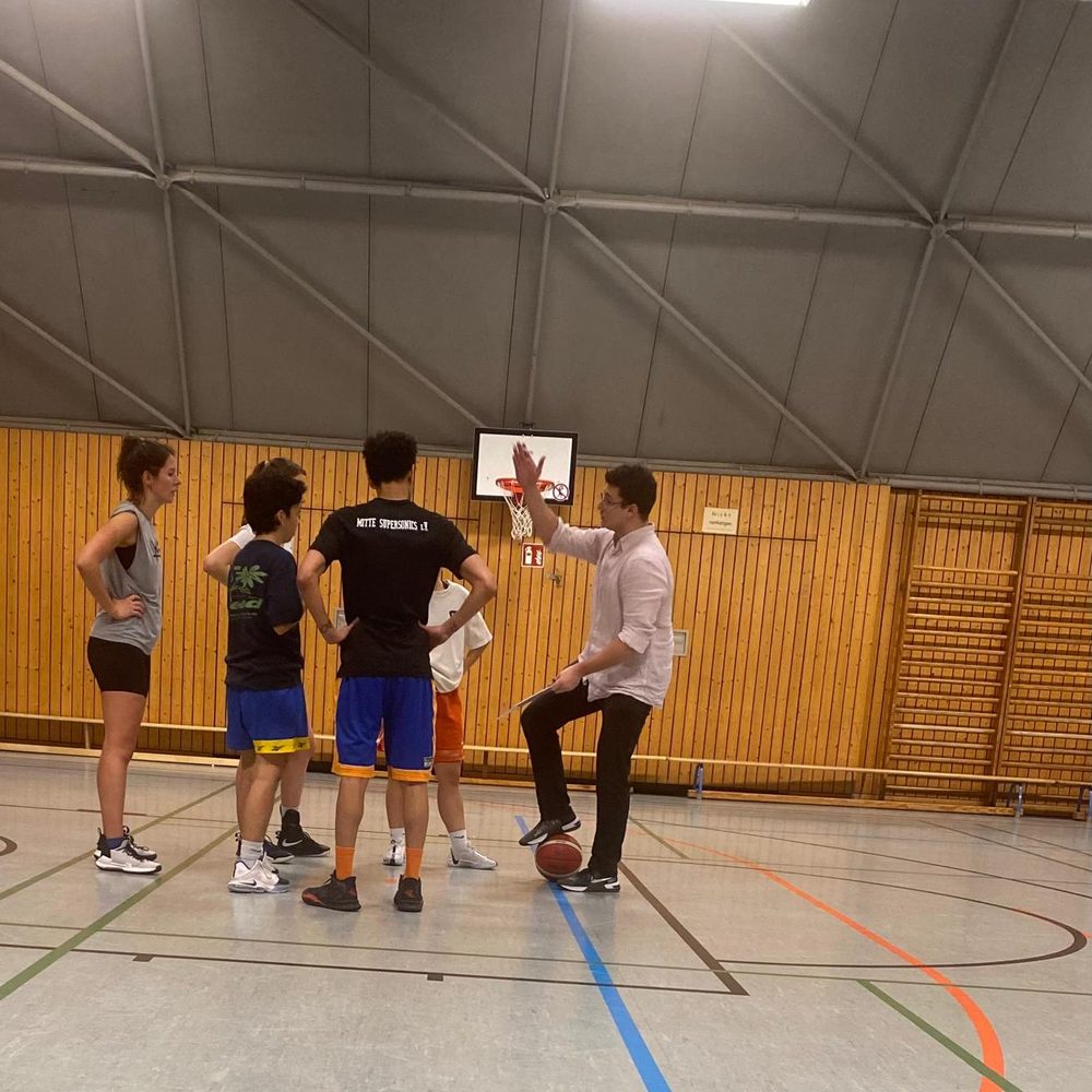 Luis coaching basketball